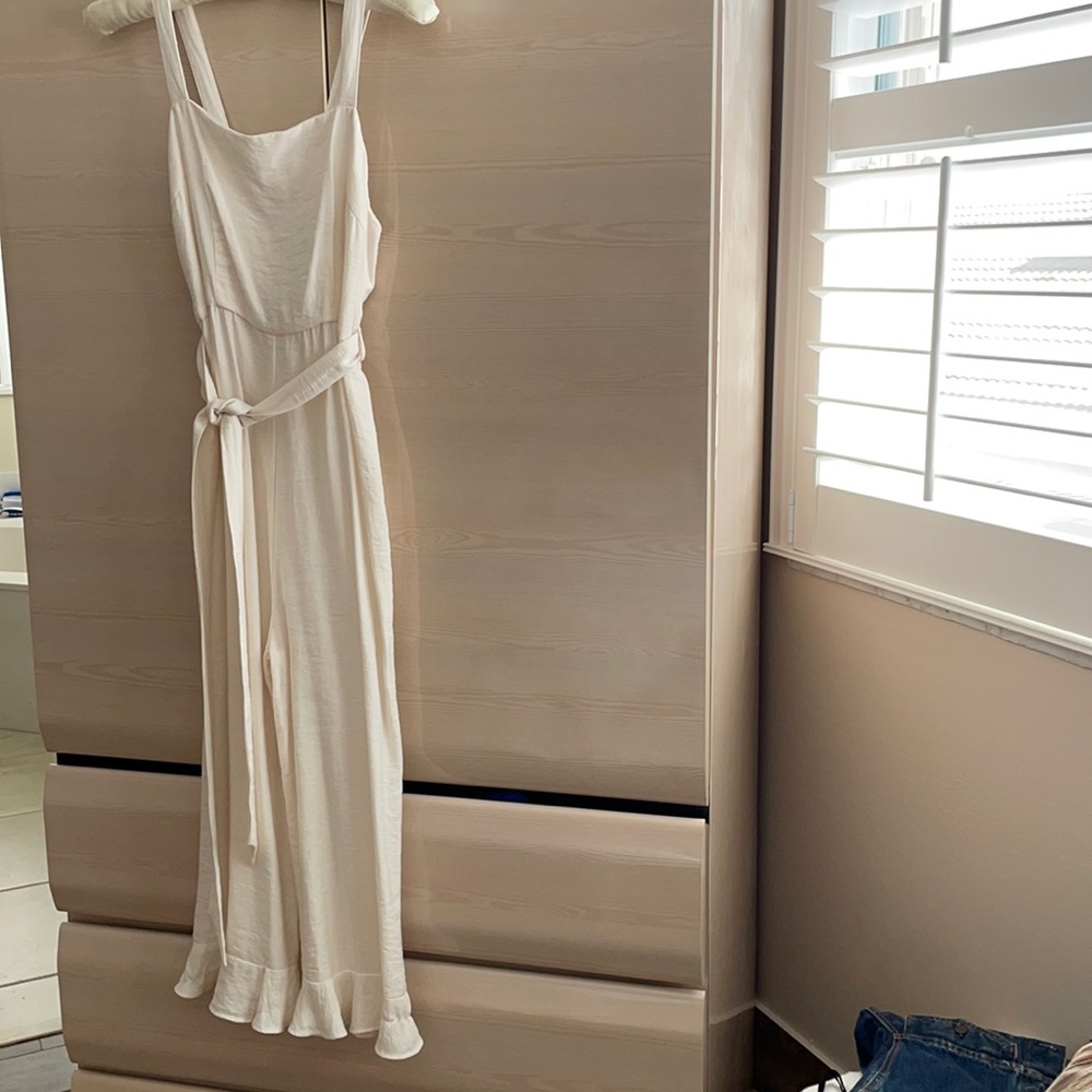 Essue cream jumpsuit ruffled hem